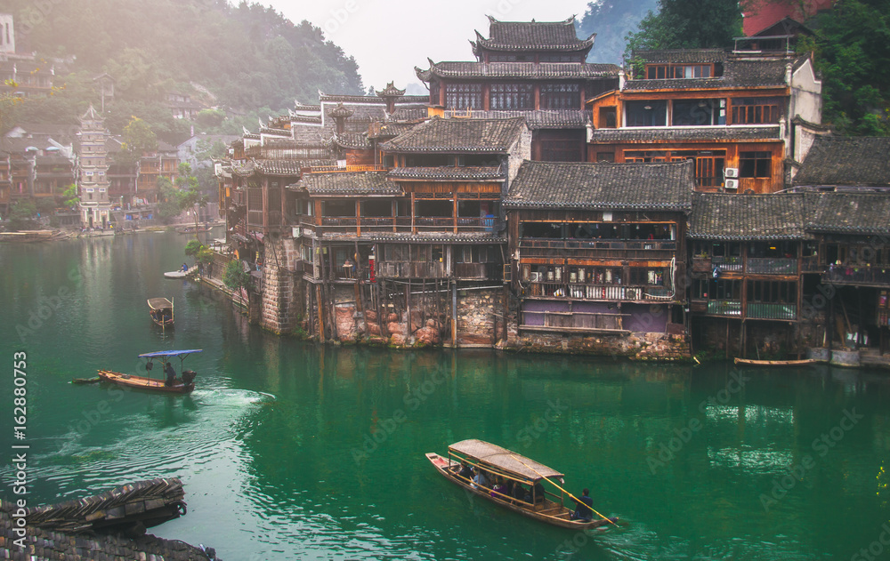 Old houses in Fenghuang county on Oct 22, 2013 in Hunan, China. The ancient town of Fenghuang was added to the UNESCO World Heritage Tentative List in the Cultural category.