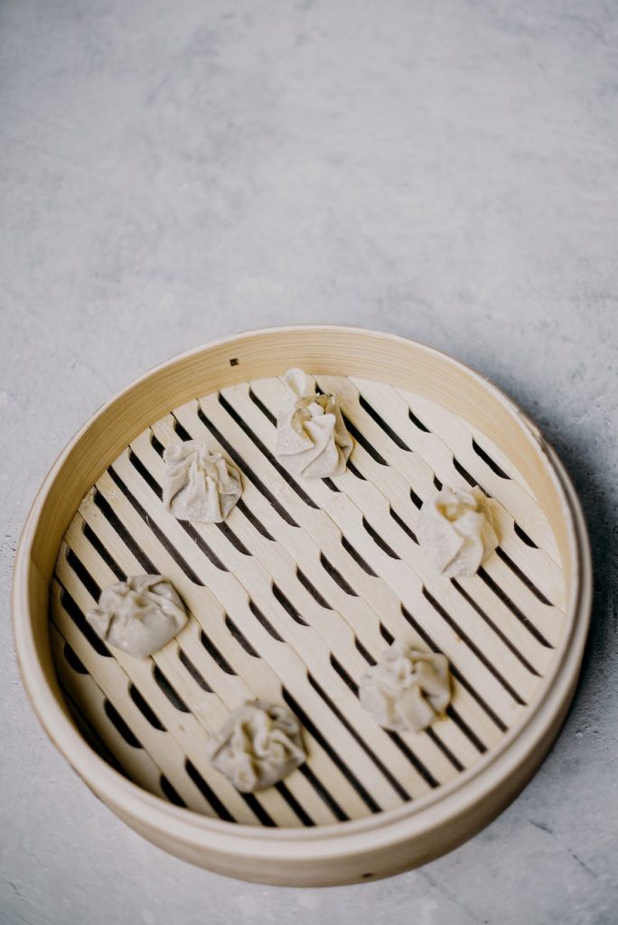 photo of dumplings on wooden tray